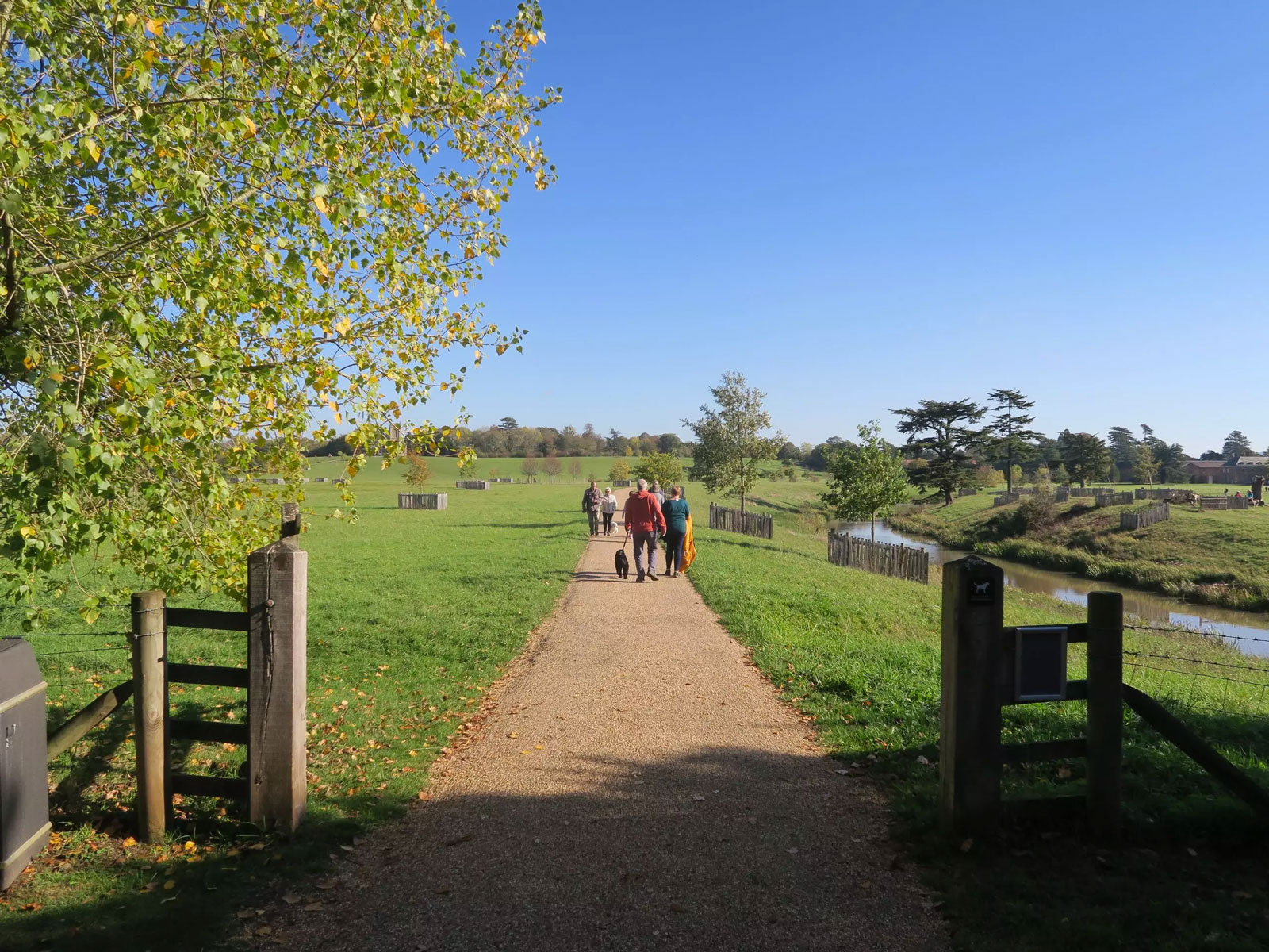 picture of a couple walking a dog otterpool park