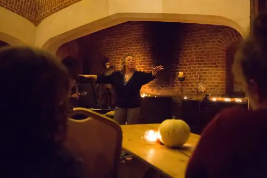 animated storyteller telling story by candlelight