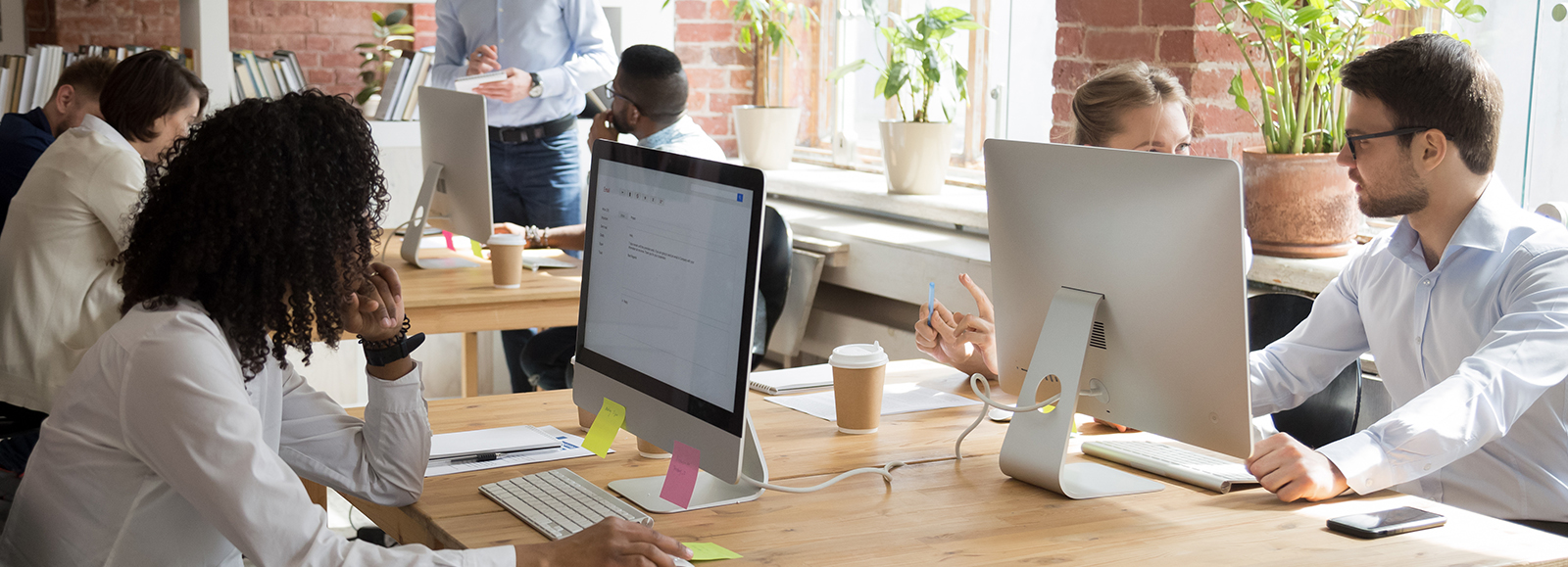 people on desk at computers - Place for businesses